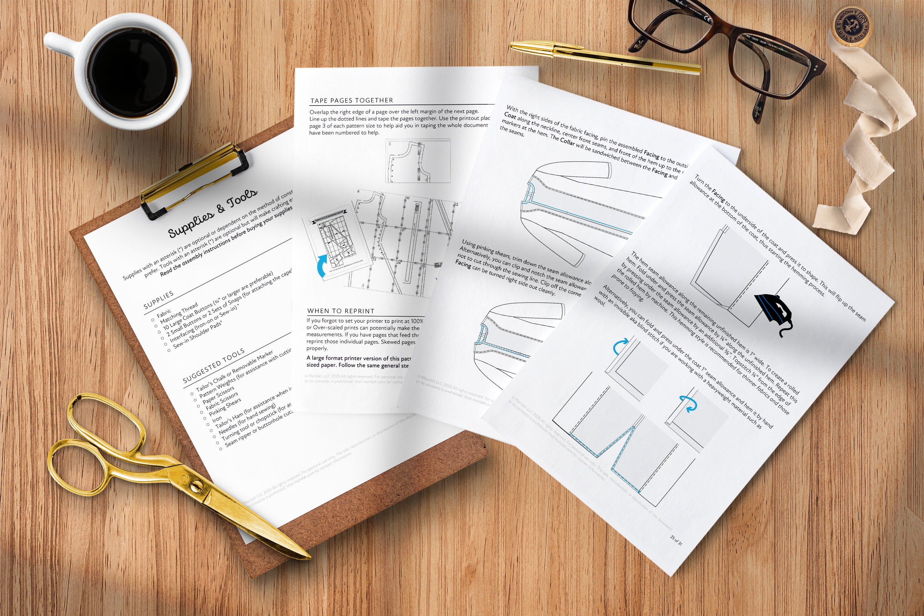 Printed pages with sewing assembly diagrams and text on a wooden surface, accompanied by a cup of coffee, glasses, and scissors.